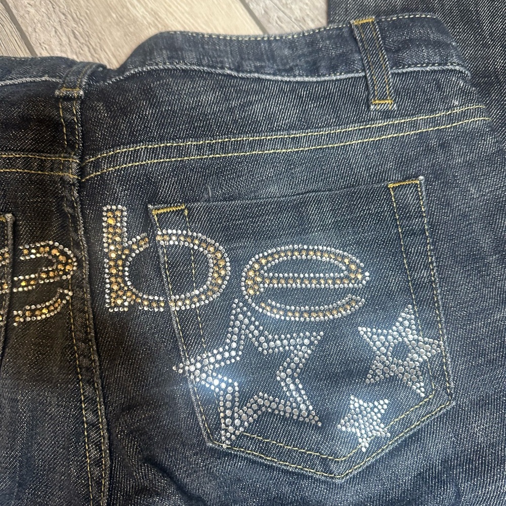 BEBE - jeans: black 'Carmen' bootcut w rear rhinestone logo & stars - 29